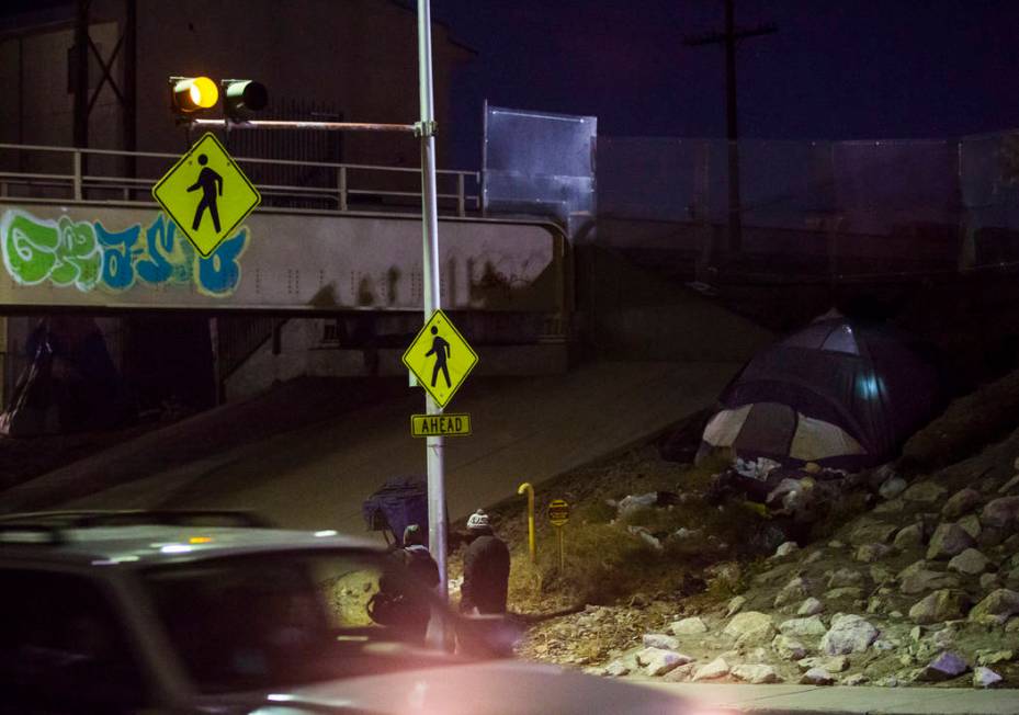 A light glows from inside a tent along Owens Avenue during the annual Southern Nevada Homeless ...