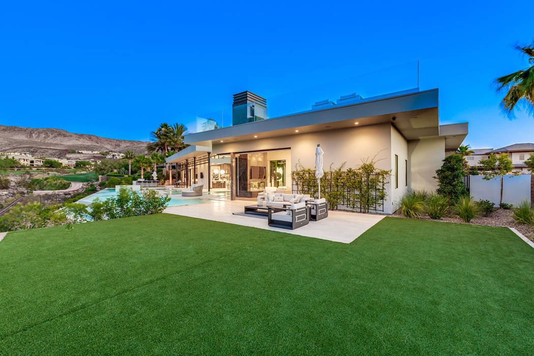 The side yard offers plenty of grassy area. (Ivan Sher Group)