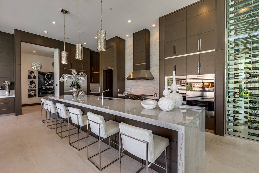 The kitchen offers a large island with seating. (Ivan Sher Group)