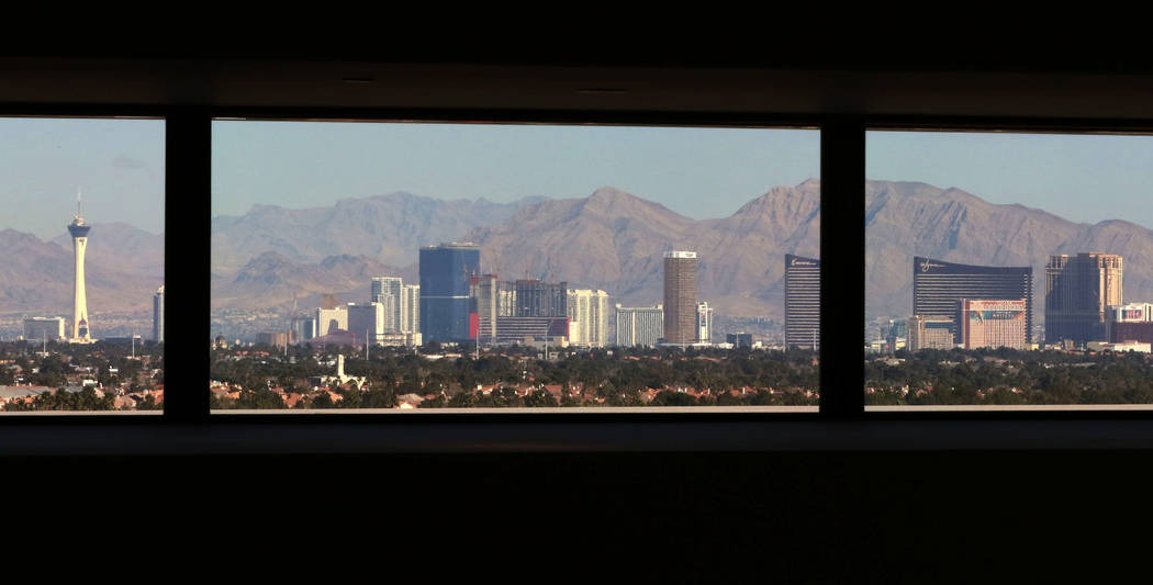 The Las Vegas Strip is seen through family room windows on Friday, Feb. 1, 2019 at the mansion of developer Jim Rhodes in the Spanish Hills community in Las Vegas. Rhodes has listed his mansion fo ...