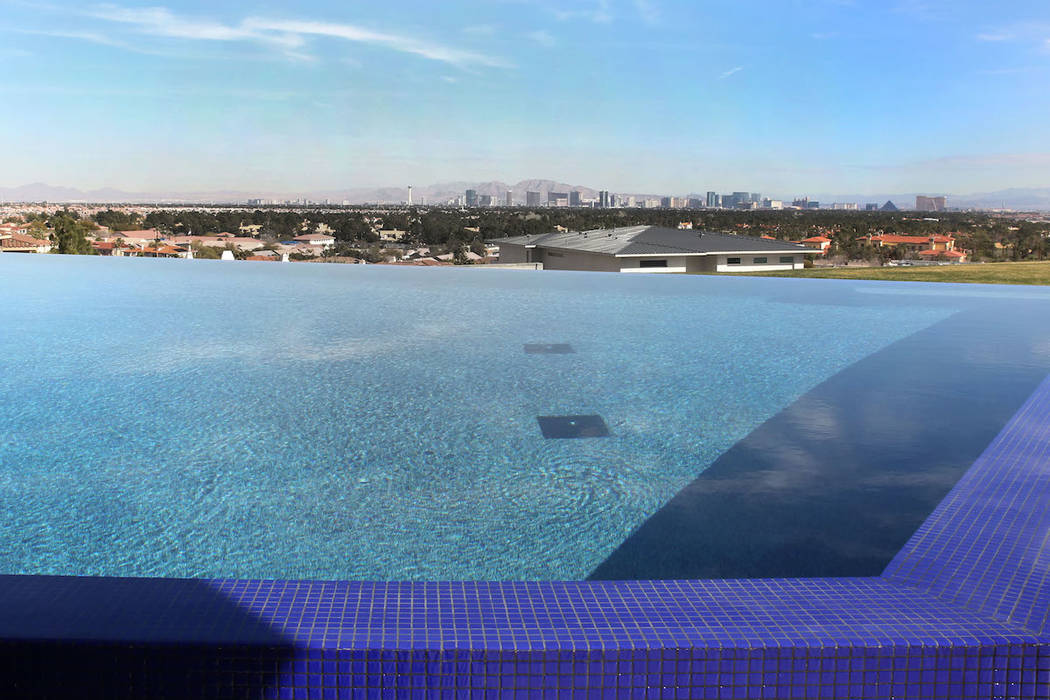 A swimming pool with view of the Las Vegas Strip at the mansion of Jim Rhodes, a developer, photographed on Friday, Feb. 1, 2019, in Spanish Hills community in Las Vegas. Rhodes has listed his man ...