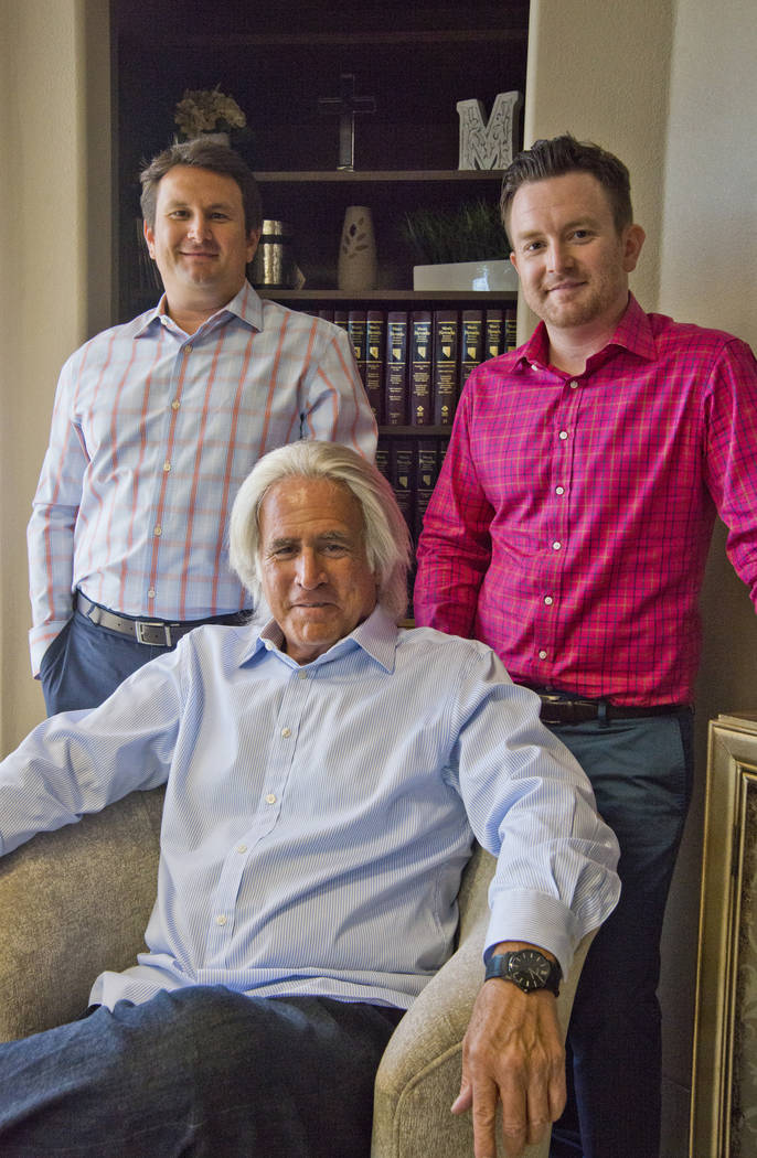Robert A. Massi poses for a photograph with his two sons, Robert, right, and Dominic inside his Henderson law offices on Monday, Aug. 15, 2016. Robert currently works with the law firm, and Domini ...