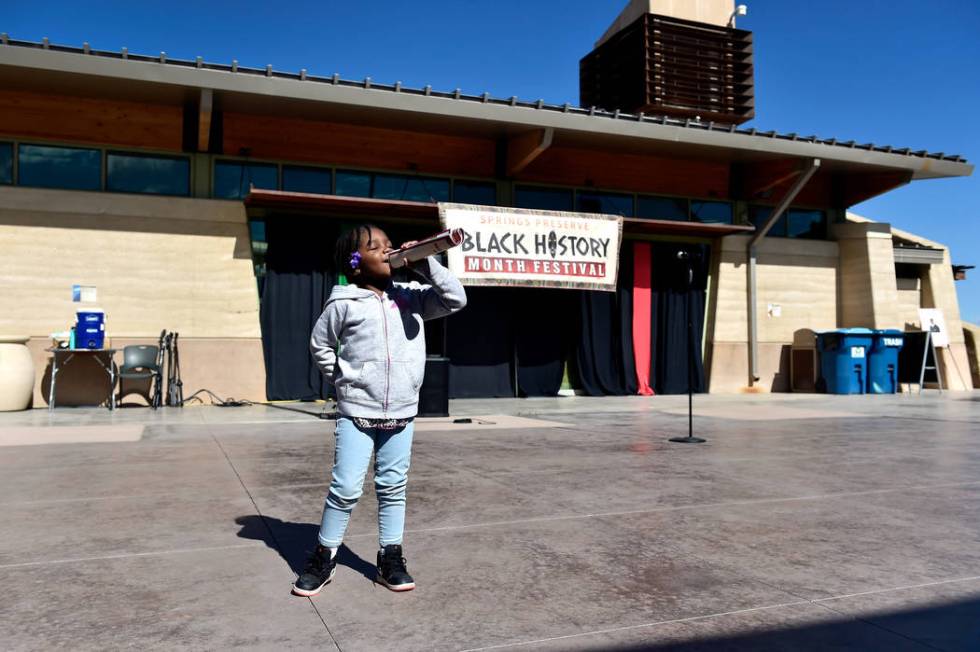 Janiyah Payne, 4, pretends to sing on stage during the Black History Month Festival at the Spri ...