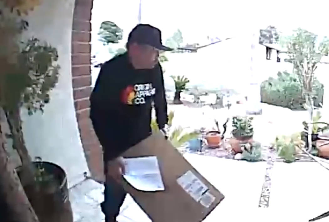 A package thief is captured on surveillance camera from the front porch of a residence located in the area of Oakey Boulevard and Torrey Pines Drive. (LVMPD)