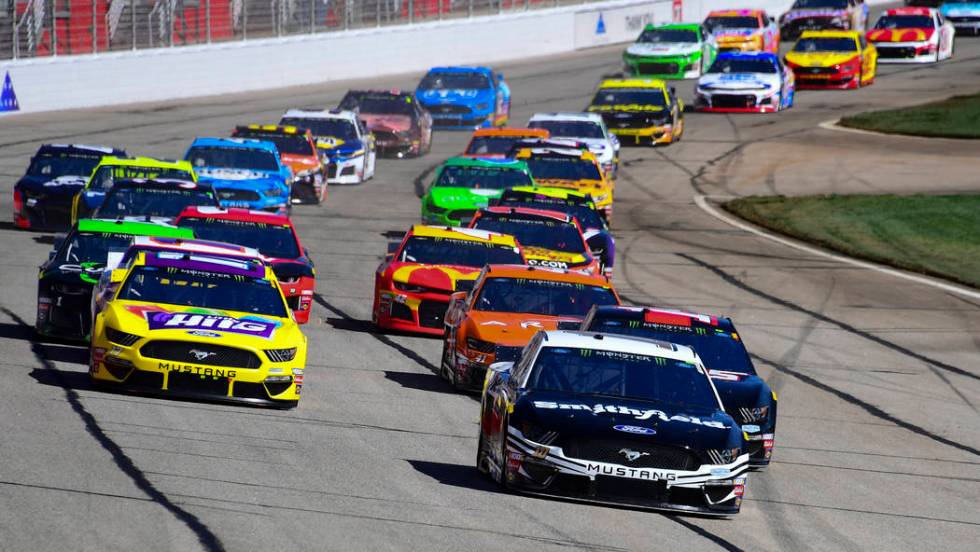 Aric Almirola leads off the start of a NASCAR Monster Energy NASCAR Cup Series auto race at Atlanta Motor Speedway, Sunday, Feb. 24, 2019, in Hampton, Ga. (AP Photo/Scott Cunningham)