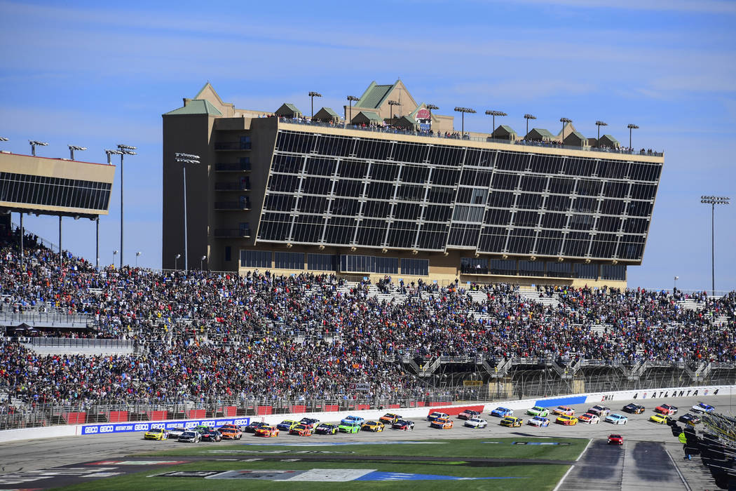 A NASCAR Monster Energy NASCAR Cup Series auto race starts at Atlanta Motor Speedway, Sunday, Feb. 24, 2019, in Hampton, Ga. (AP Photo/Scott Cunningham)