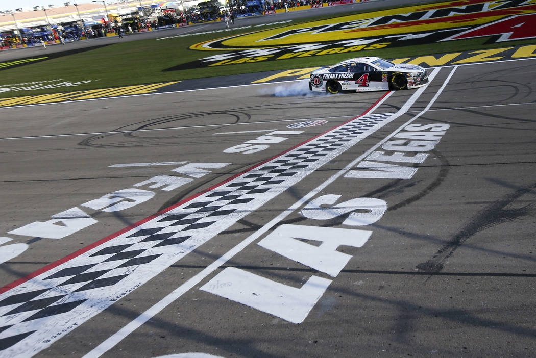 Kevin Harvick (4) crosses the finish line to win the Monster Energy NASCAR Cup Series Pennzoil 400 auto race at the Las Vegas Motor Speedway in Las Vegas on Sunday, March 4, 2018. Chase Stevens La ...