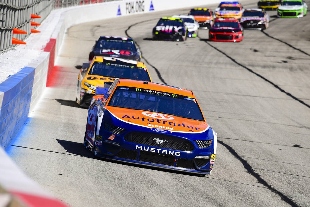 Brad Keselowski leads a row of cars as they come through the front stretch during a Monster Energy NASCAR Cup Series auto race at Atlanta Motor Speedway, Sunday, Feb. 24, 2019, in Hampton, Ga. Kes ...