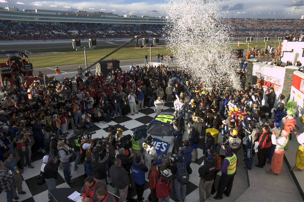 Jimmie Johnson celebrates in victory lane after winning the NASCAR Nextel Cup UAW-DaimlerChrysler 400 at Las Vegas Motor Speeway Sunday, March 12, 2006. (K.M. Cannon/Las Vegas Review-Journal)