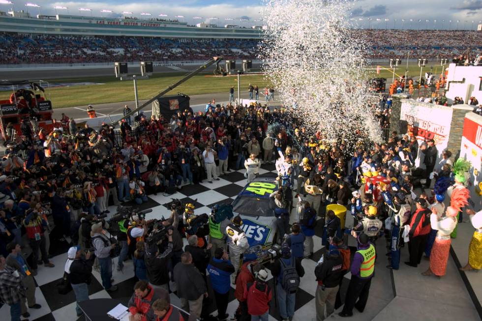 Jimmie Johnson celebrates in victory lane after winning the NASCAR Nextel Cup UAW-DaimlerChrysler 400 at Las Vegas Motor Speeway Sunday, March 12, 2006. (K.M. Cannon/Las Vegas Review-Journal)