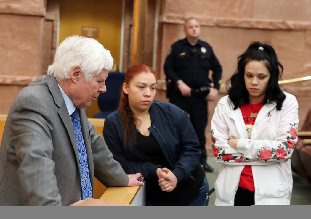 Amber Bustillos, right, a fiance of Junior Lopez, a man fatally shot by Las Vegas police in April, and her friend Carla Varela chat on Thursday, Feb. 28, 2019, with defense attorney Terrence Jacks ...