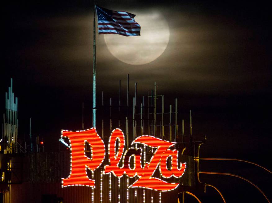 A super snow moon rises over the Plaza in downtown Las Vegas as seen from the World Market Cent ...