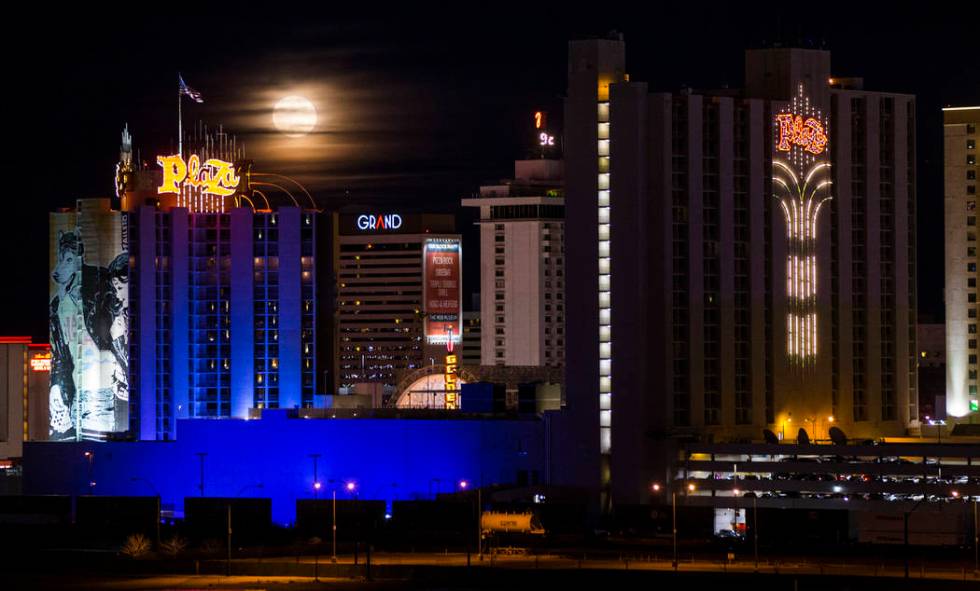 A super snow moon rises over the Plaza in downtown Las Vegas as seen from the World Market Cent ...