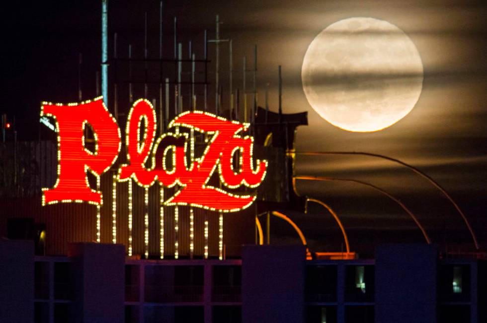 A super snow moon rises over the Plaza in downtown Las Vegas as seen from the World Market Cent ...