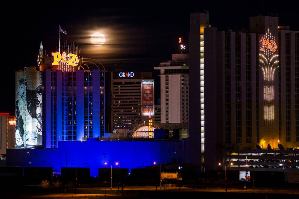 A super snow moon rises over the Plaza in downtown Las Vegas as seen from the World Market Cent ...