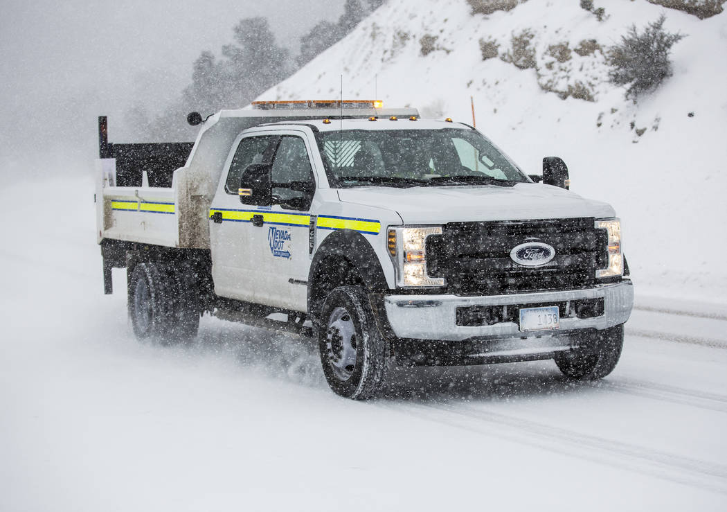 A Nevada Department of Transportation vehicle drives in heavy snow at Mount Charleston on Wednesday, Feb. 20, 2019, outside Las Vegas. (Benjamin Hager Review-Journal) @BenjaminHphoto
