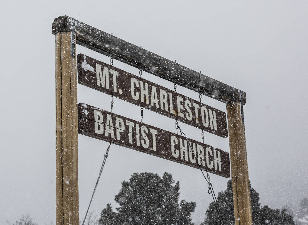 The sign for Mt. Charleston Baptist Church is blanketed in snow on Wednesday, Feb. 20, 2019, at Mount Charleston, outside Las Vegas. (Benjamin Hager Review-Journal) @BenjaminHphoto