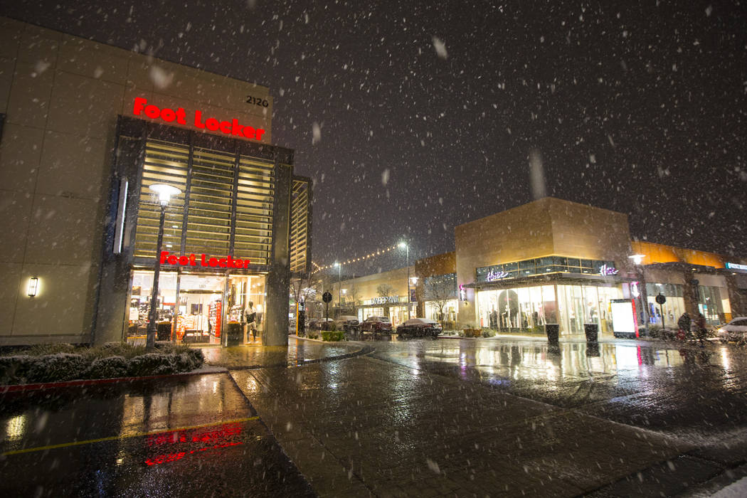 Snow falls around Downtown Summerlin in Las Vegas on Wednesday, Feb. 20, 2019. (Chase Stevens/Las Vegas Review-Journal) @csstevensphoto