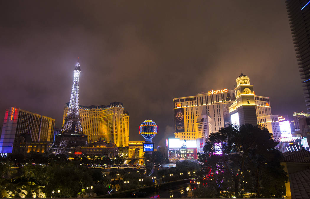 A view of the Paris Las Vegas and Planet Hollywood as snow falls in Las Vegas on Wednesday, Feb. 20, 2019. (Chase Stevens/Las Vegas Review-Journal) @csstevensphoto