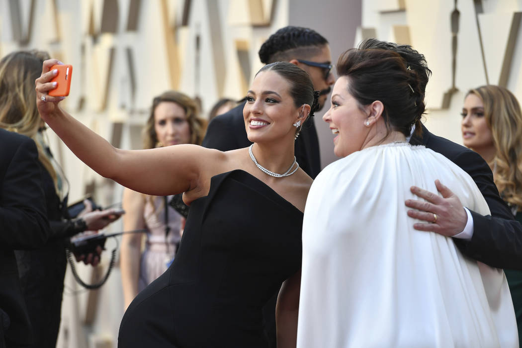 Ashley Graham, left, and Melissa McCarthy arrive at the Oscars on Sunday, Feb. 24, 2019, at the Dolby Theatre in Los Angeles. (Photo by Jordan Strauss/Invision/AP)