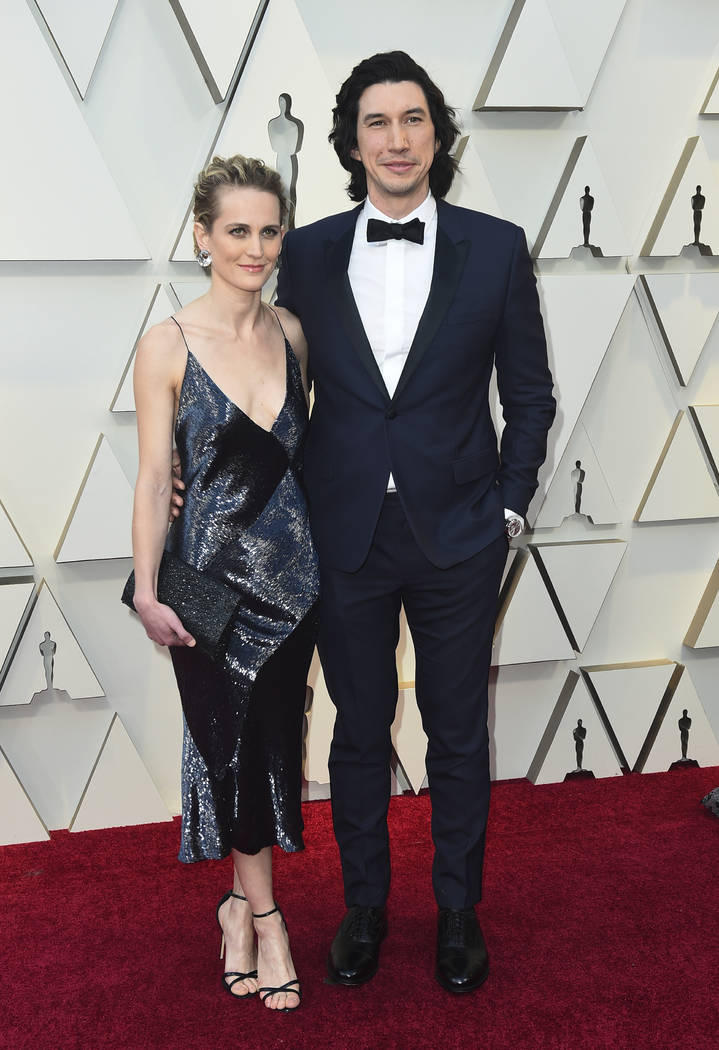 Joanne Tucker, left, and Adam Driver arrives at the Oscars on Sunday, Feb. 24, 2019, at the Dolby Theatre in Los Angeles. (Photo by Jordan Strauss/Invision/AP)