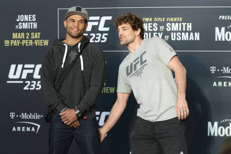 Welterweight Ben Askren grabs Robbie Lawler's leg after a staredown at a media day in the T-Mobile Arena to promote their fight at UFC 235 in Las Vegas, Wednesday, Feb. 27, 2019. (Heidi Fang /Las ...