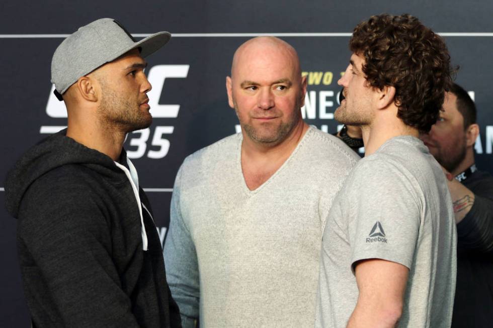 UFC welterweights Robbie Lawler, left, and Ben Askren, right, face off in front of UFC president Dana White at UFC 235 media day at the T-Mobile Arena in Las Vegas, Wednesday, Feb. 27, 2019. (Heid ...