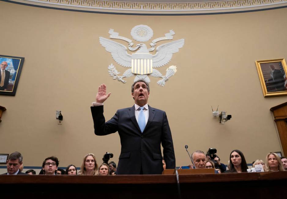 Michael Cohen, President Donald Trump's former personal lawyer, is sworn in to testify before the House Oversight and Reform Committee on Capitol Hill in Washington, Wednesday, Feb. 27, 2019. (AP ...