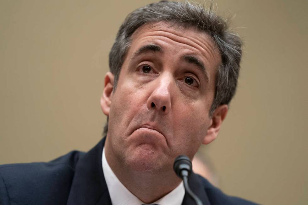 Michael Cohen, President Donald Trump's former personal lawyer, reads an opening statement as he testifies before the House Oversight and Reform Committee on Capitol Hill in Washington, Wednesday, ...