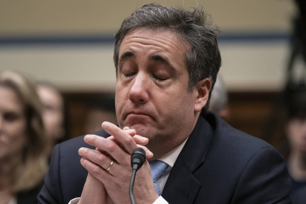 Michael Cohen, President Donald Trump's former personal lawyer, becomes emotional as he finishes a day of testimony to the House Oversight and Reform Committee, on Capitol Hill in Washington, Wedn ...