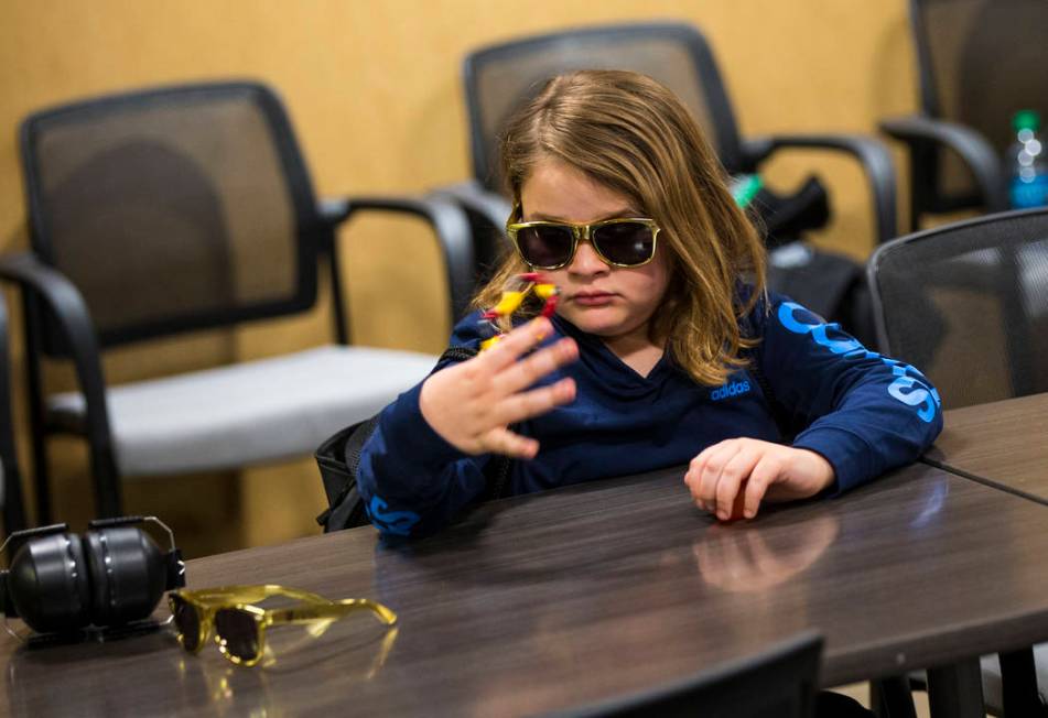 Christian Mouer, 11, plays with a fidget toy from a sensory bag before a Golden Knights game at T-Mobile Arena in Las Vegas on Tuesday, Feb. 26, 2019. The sensory bag features noise-cancelling hea ...