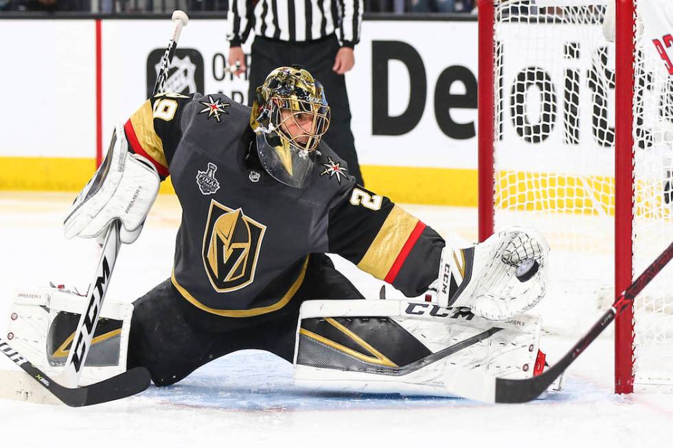 Golden Knights goaltender Marc-Andre Fleury (29) blocks a shot from Washington Capitals center Evgeny Kuznetsov, not pictured, during the second period of Game 5 of the Stanley Cup Final at T-Mobi ...