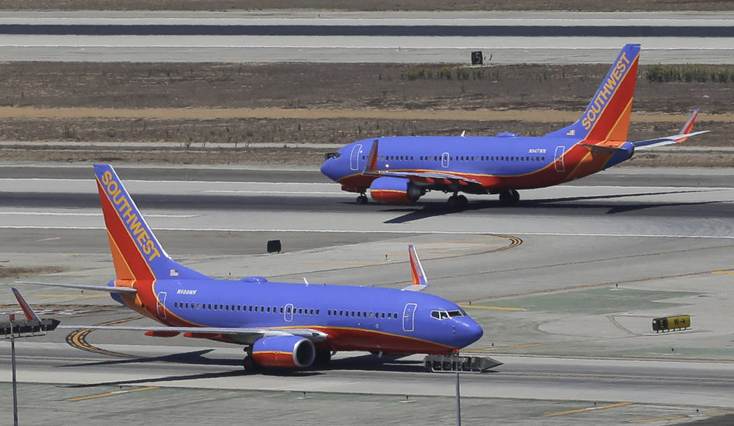 Southwest Airlines says it has gained government approval to begin flights between California and Hawaii, capping a long effort that was delayed by the government shutdown. (AP Photo/Reed Saxon, File)