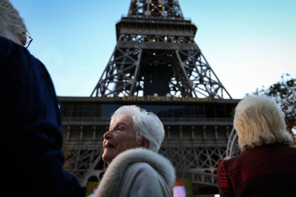 French singer and actress Line Renaud talks with attendees before the Paris Las Vegas debuts a new $1.7 million Eiffel Tower light show on the Strip in Las Vegas, Wednesday, Feb. 27, 2019. (Caroli ...