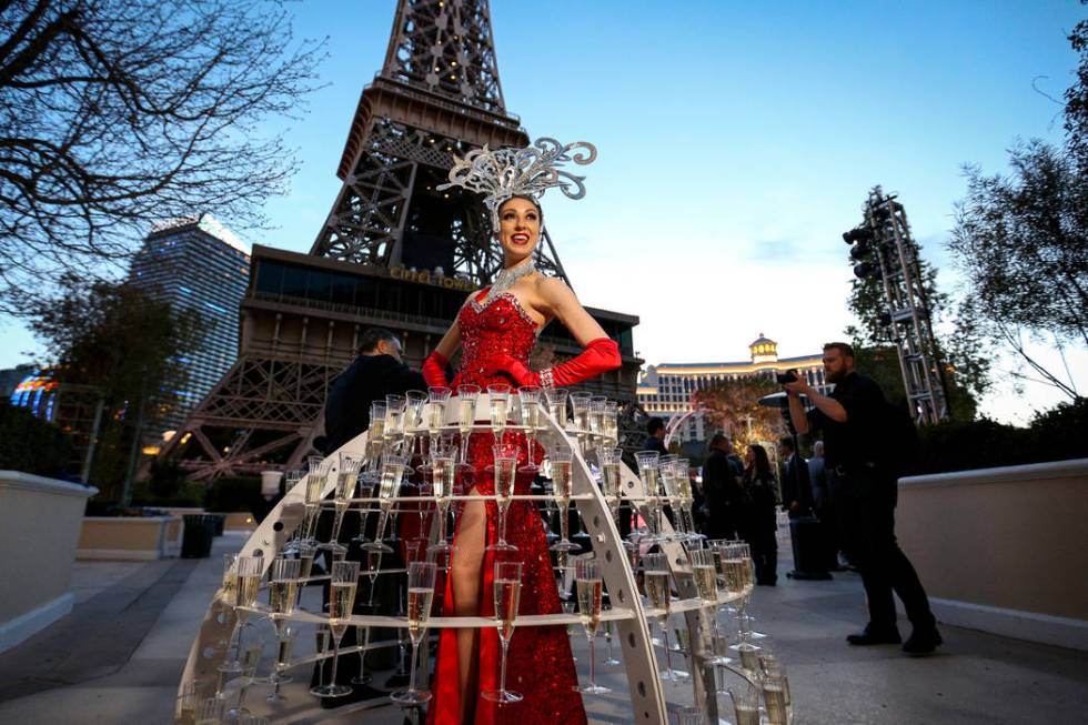 Alexandra Remke poses in a champagne dress structure at the Paris Las Vegas as it debuts a new $1.7 million Eiffel Tower light show on the Strip in Las Vegas, Wednesday, Feb. 27, 2019. (Caroline B ...