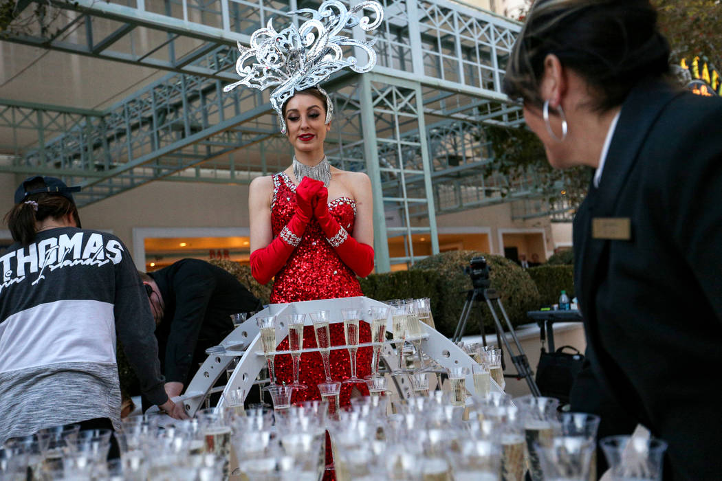 Alexandra Remke stands in a champagne dress structure at the Paris Las Vegas as it debuts a new $1.7 million Eiffel Tower light show on the Strip in Las Vegas, Wednesday, Feb. 27, 2019. (Caroline ...