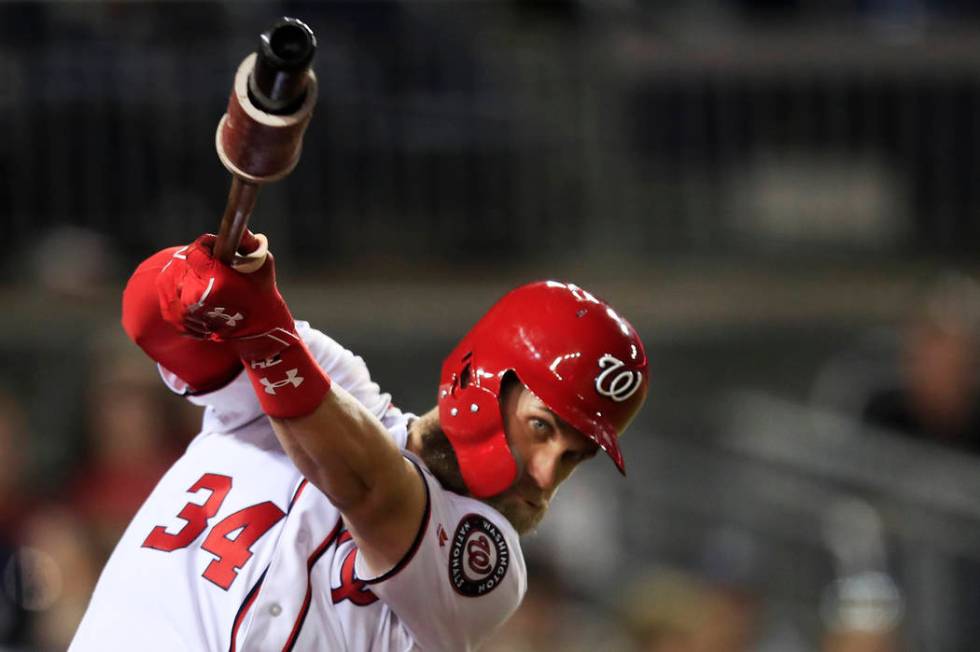 Washington Nationals Bryce Harper practices his swing during the seventh inning of a baseball game against the Miami Marlins in Washington, Wednesday, Sept. 26, 2018. (AP Photo/Manuel Balce Ceneta)