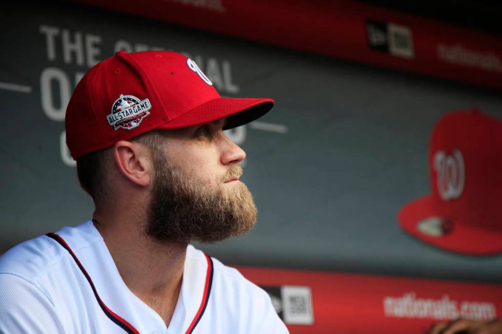 FILE - In this Sept. 26, 2018, file photo, Washington Nationals' Bryce Harper, looks at the baseball field from their dug out before the start of the Nationals last home game of the season against ...