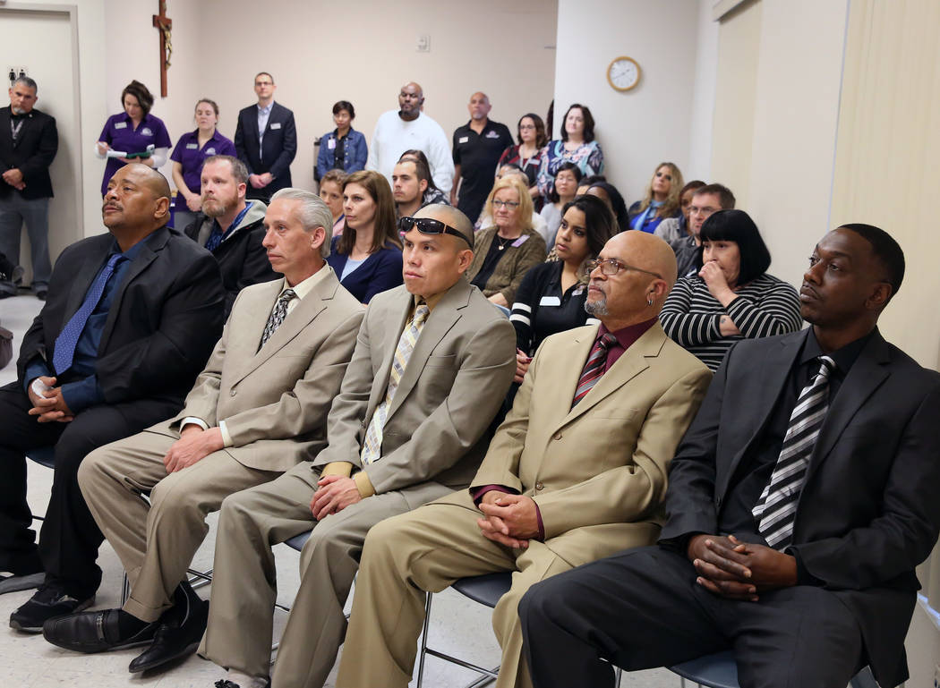 Graduates Broderick Gray, right, Theodore Hines, Derrick Johnson, center, Ricky Delucia, and John Bontemps attend the Renewing HOPE graduation for homeless who spend nine months in Catholic Charit ...