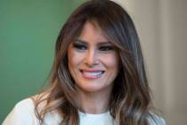 In this Monday, Nov. 27, 2017 file photo, First lady Melania Trump smiles as she visits with children in the East Room of the White House in Washington. (Carolyn Kaster/AP file)