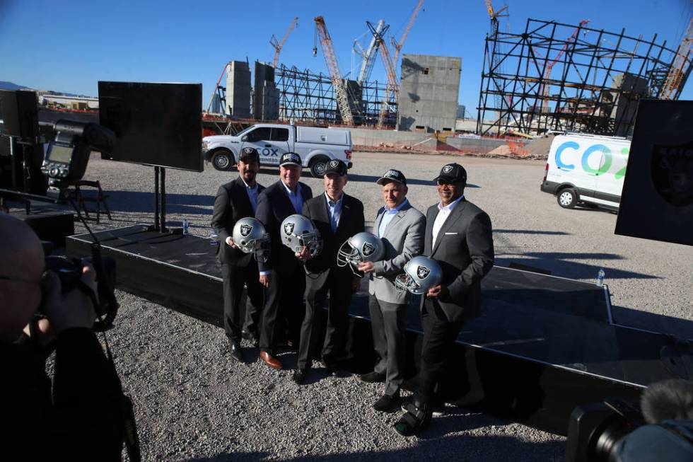 Mark Shearer, from left, Raiders senior vice president, Mike Bolognini, market vice president for Cox Communications Las Vegas, Pat Esser, president of Cox Communications, Marc Badain, president o ...