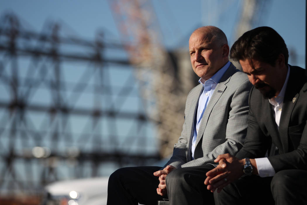 Marc Badain, left, president for the Raiders, and Mark Shearer, senior vice president for the Raiders, participate during a press conference at the Raiders stadium construction site in Las Vegas, ...