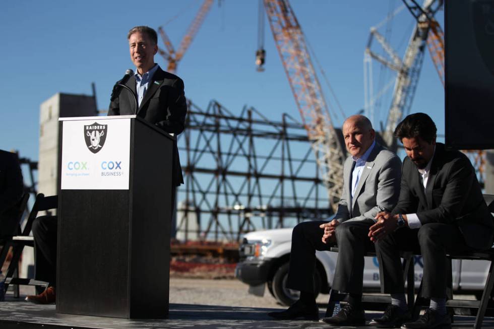 Pat Esser, from left, president of Cox Communications, with Marc Badain, president for the Raiders, and Mark Shearer, senior vice president for the Raiders, speaks during a press conference at the ...