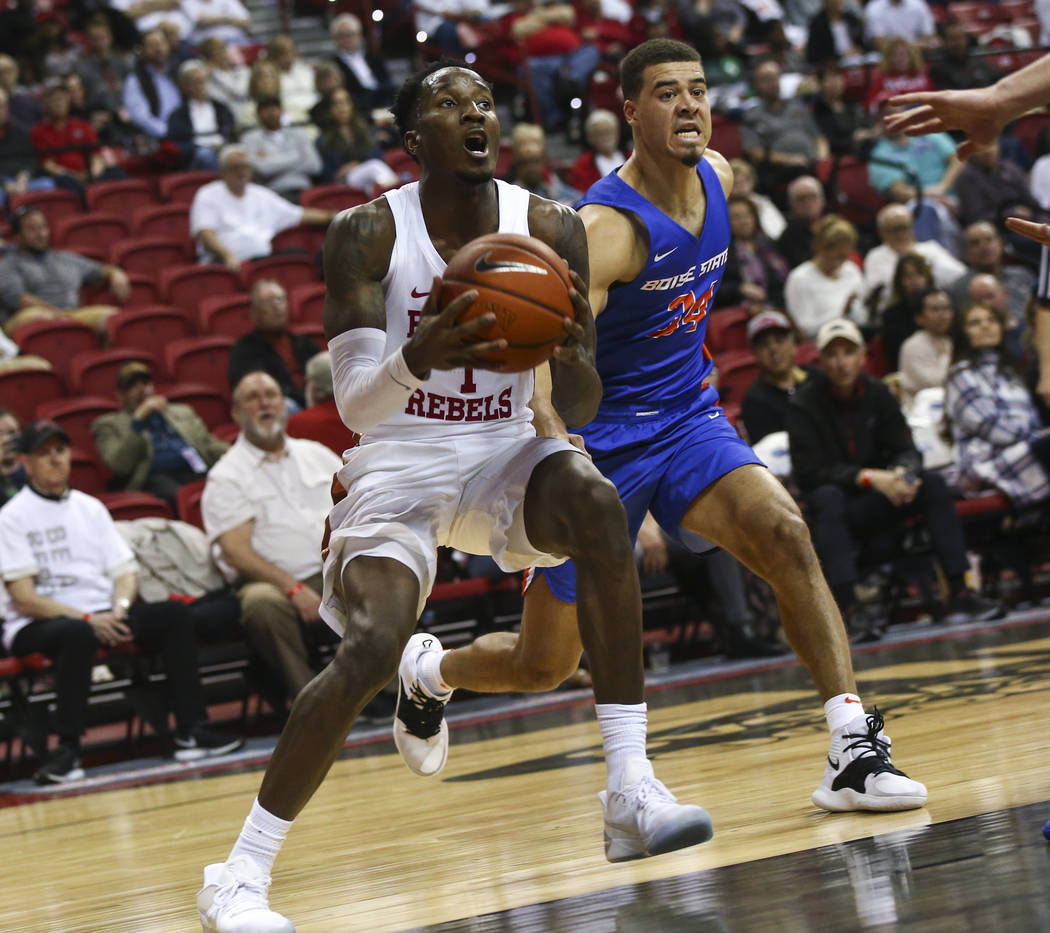 UNLV Rebels guard Kris Clyburn (1) drives to the basket against Boise State Broncos guard Alex Hobbs (34) during the first half of a basketball game at the Thomas & Mack Center in Las Vegas on ...