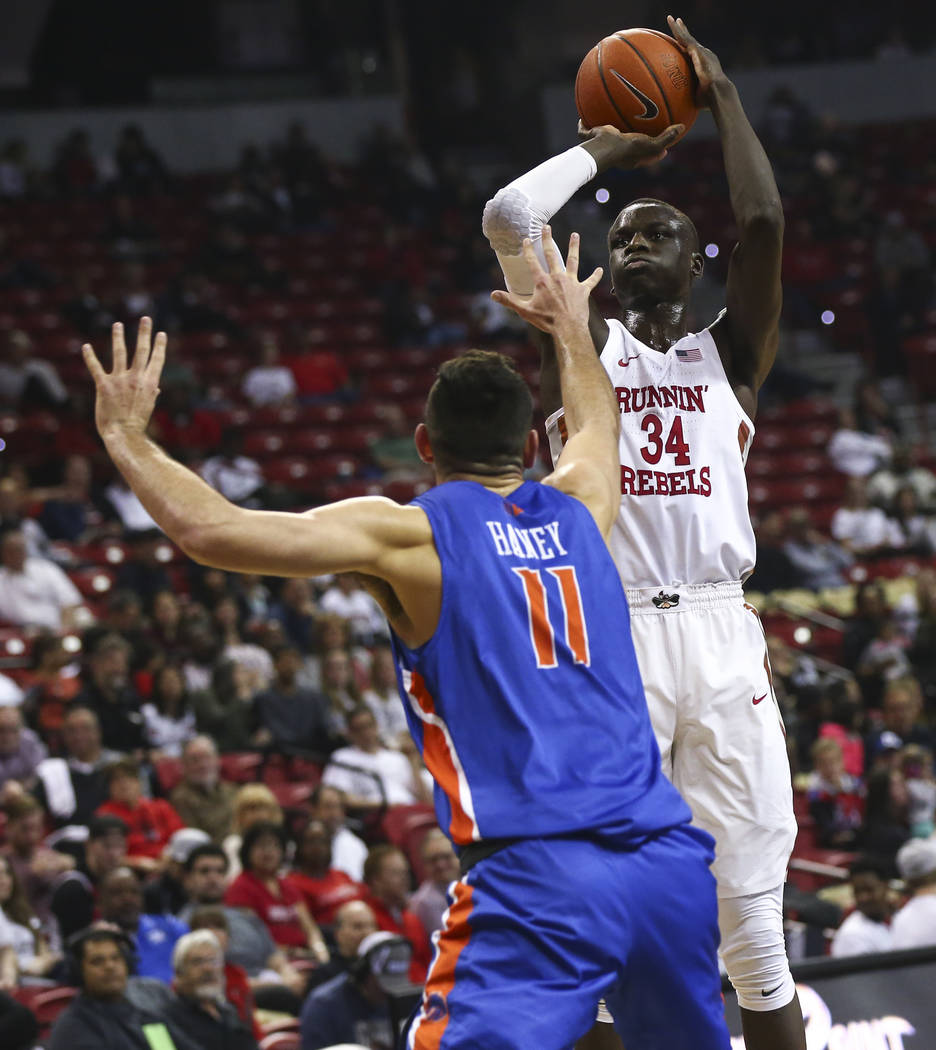 UNLV Rebels forward Cheikh Mbacke Diong (34) shoots over Boise State Broncos guard Zach Haney (11) during the first half of a basketball game at the Thomas & Mack Center in Las Vegas on Saturd ...