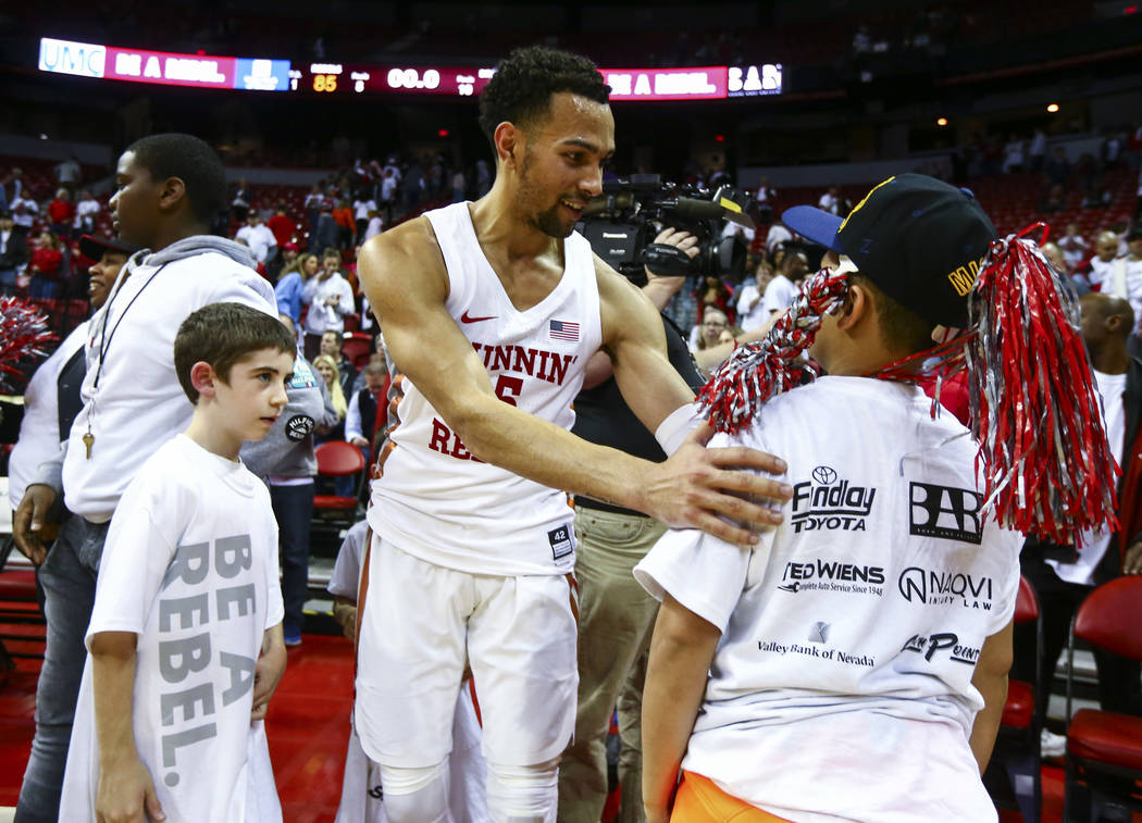 UNLV Rebels guard Noah Robotham celebrates his team's overtime win against Boise State with fans after a basketball game at the Thomas & Mack Center in Las Vegas on Saturday, March 2, 2019. (C ...