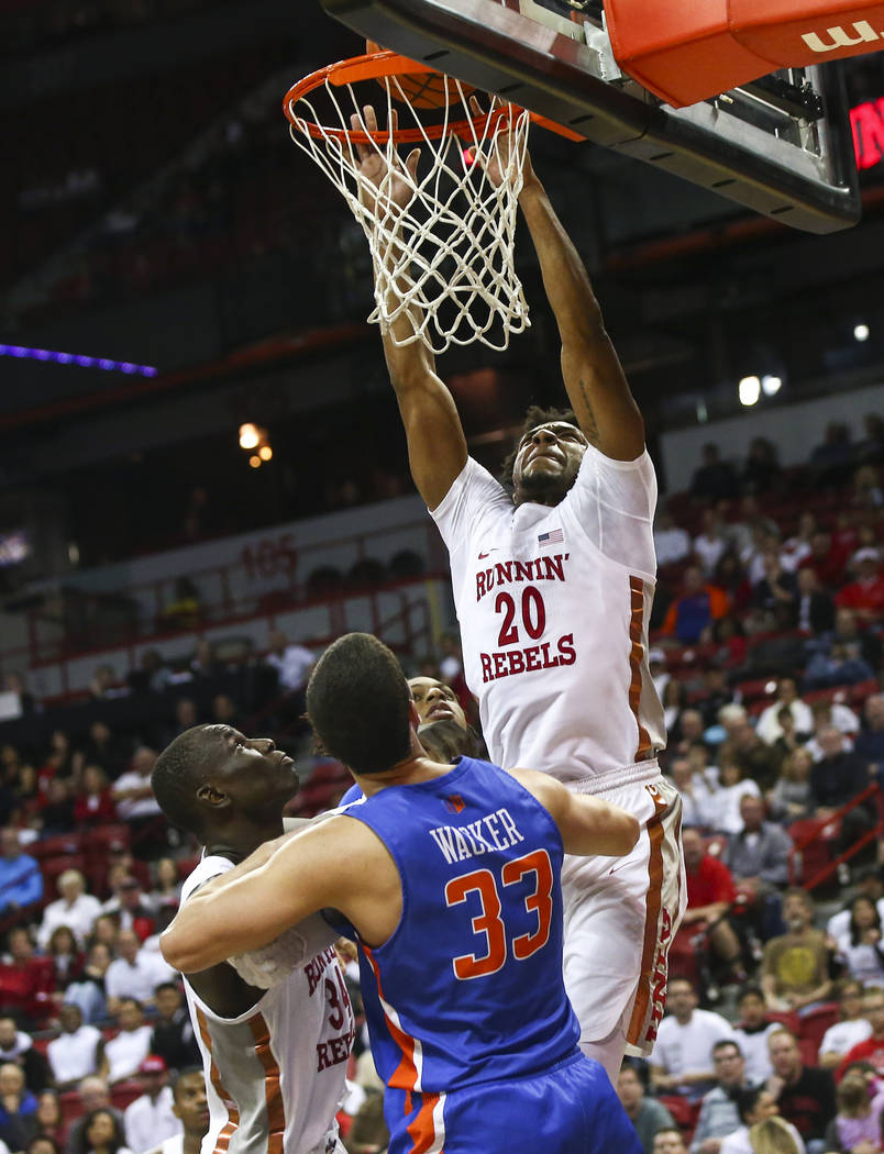 UNLV Rebels forward Nick Blair (20) dunks over Boise State Broncos forward David Wacker (33) during the second half of a basketball game at the Thomas & Mack Center in Las Vegas on Saturday, M ...