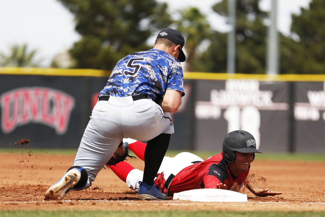 Dillon Johnson, shown sliding last season, had four hits and scored three runs Friday to help UNLV to a 7-6 win over UNR at Wilson Stadium. (Andrea Cornejo/Las Vegas Review-Journal @dreacornejo)