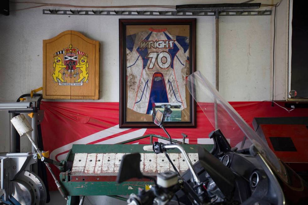 Angie's brother Chris Wright's jersey hangs on the wall in her father's garage in Henderson, Wednesday, March 6, 2019. Angie will be racing in the Mint 400's motorcycle race, the first dirt bike r ...