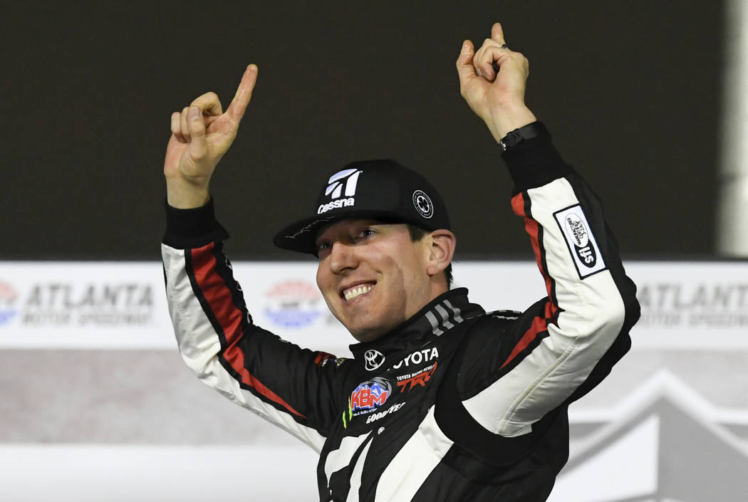 Kyle Busch celebrates after winning the NASCAR Truck Series auto race at Atlanta Motor Speedway, Saturday, Feb. 23, 2019, in Hampton, Ga. (AP Photo/John Amis)